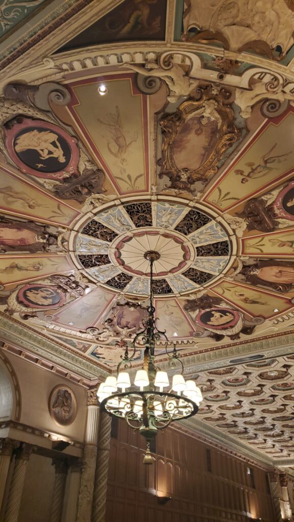 incredible artistic ceiling and chandelier inside the millennium biltmore hotel dtla