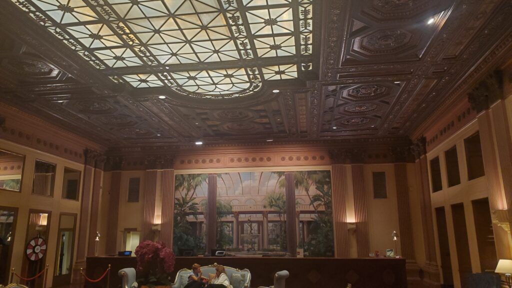 amazing ceiling and mosaic art of the millennium biltmore hotel in downtown los angeles (dtla) with people in front