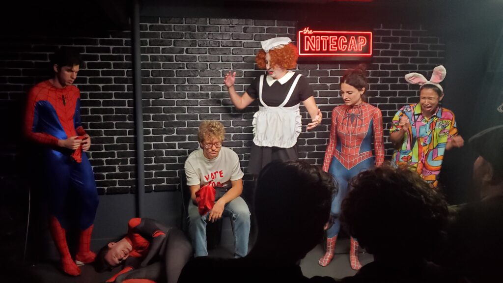 improv actors in the brick wall nitecap comedy club, one of them murdered