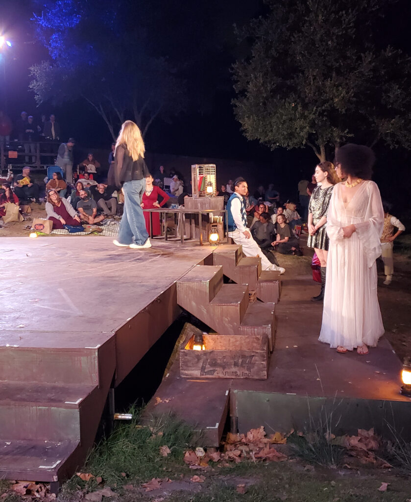 actors next to the slab theater in the round stage at griffith park, in fantasy costumes