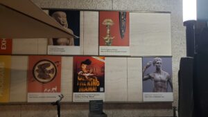 Wall display at Getty Villa with upcoming shows and events, including Oedipus the King Mama