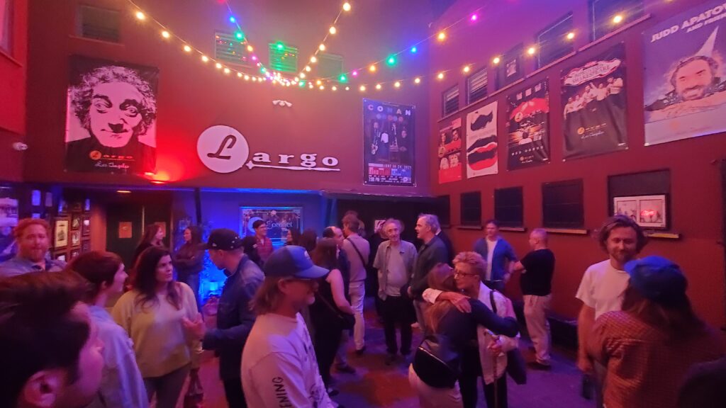 largo at the coronet courtyard lobby with crowd after the play, actors talking to guests