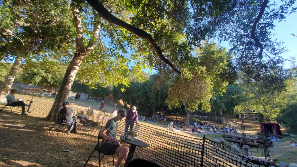 wide angle of griffith park, trees, hillsides, stage, fence