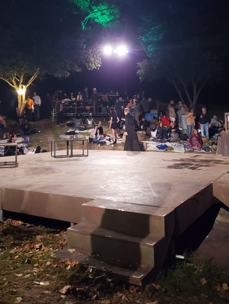 the griffith park stage for indie shakespeare at night with david melville as doctor faustus in back