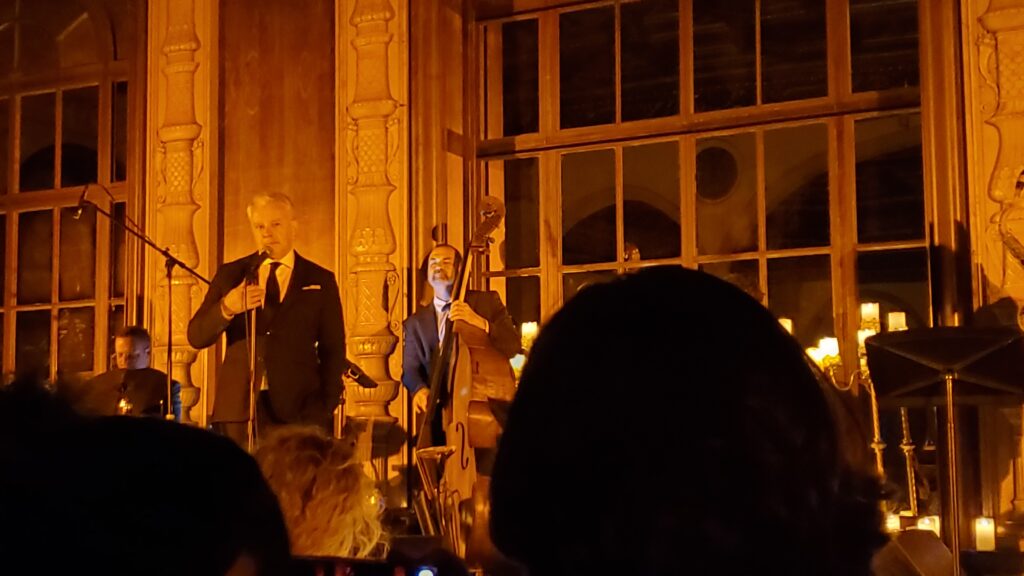 shelton and the upright bassist on stage performing frank sinatra songs