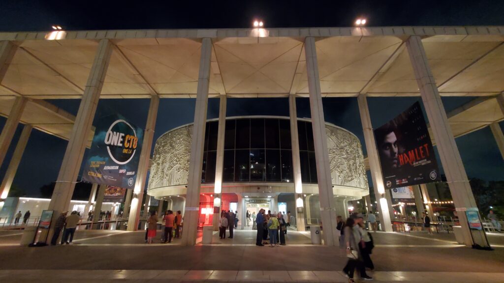 Wide-shot exterior of the Mark Taper Forum Theater in Downtown Los Angeles at night.